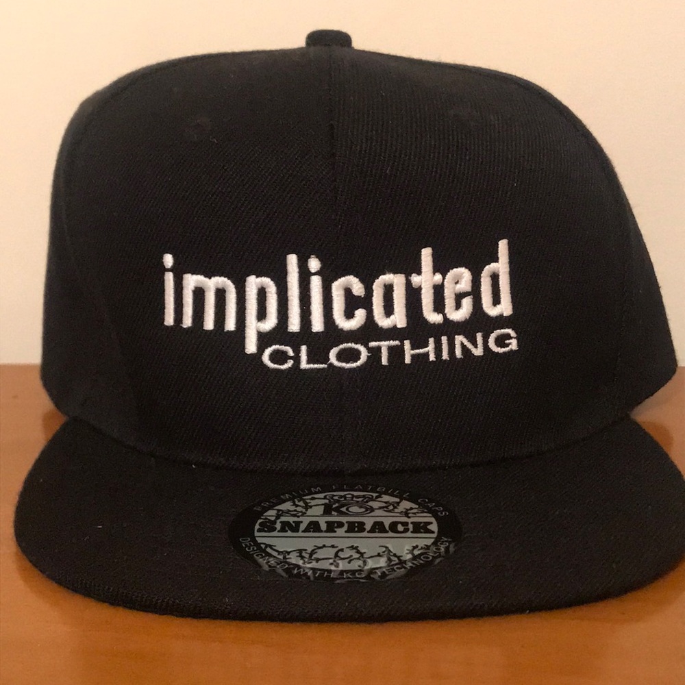 Black “Implicated Clothing” Snap Back Hat